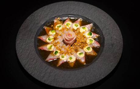 Thinly sliced hamachi belly, topped with jalapeno, crunchy garlic, scallions
